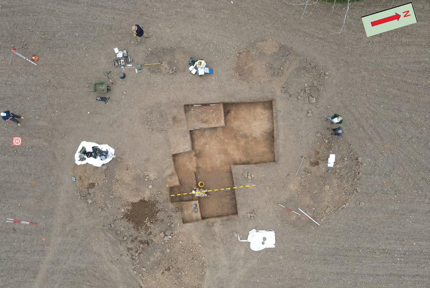 right Overlooking 2022’s trench at the end of Week 1. The dotted line indicates the alignment of the rampart posts.