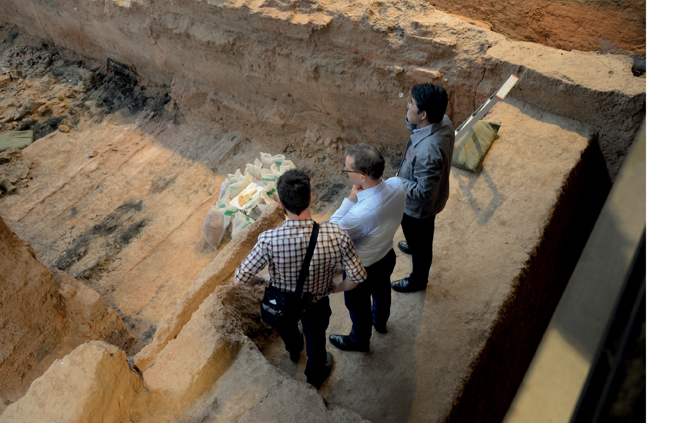 8. Professor Lukas Nickel and head excavator Zhang Weixing in the ‘Acrobat’ Pit K9901. Photograph: Duncan Singh. 9. Kneeling archer (probably originally holding a crossbow)from Pit 1, Lintong. Photograph: Lukas Nickel. 10. Terracotta figure, 1st century AD, from the ‘Acrobat’ Pit K9901, Lintong. H. 171cm. Photograph: Lukas Nickel.