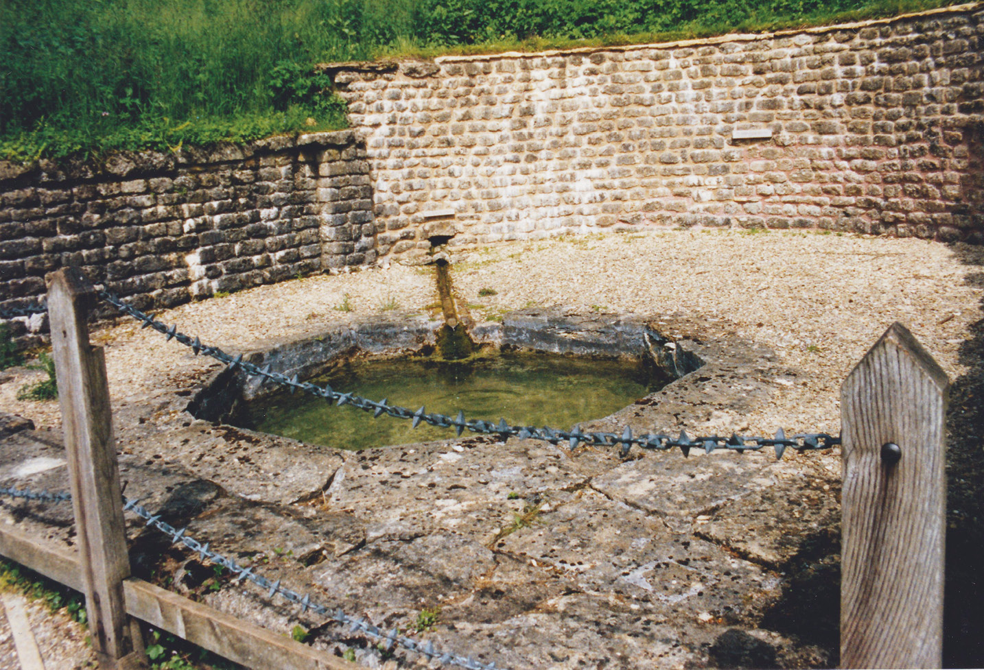 left The Chedworth nymphaeum: the slight curve to the S-panel from the villa suggests that it might have formed part of a cresting on top of the back wall.