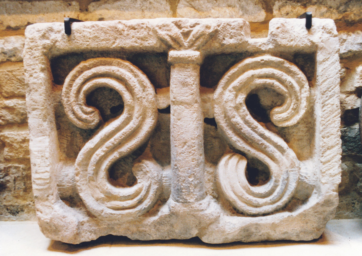 below The S-panel from the Chedworth nymphaeum.