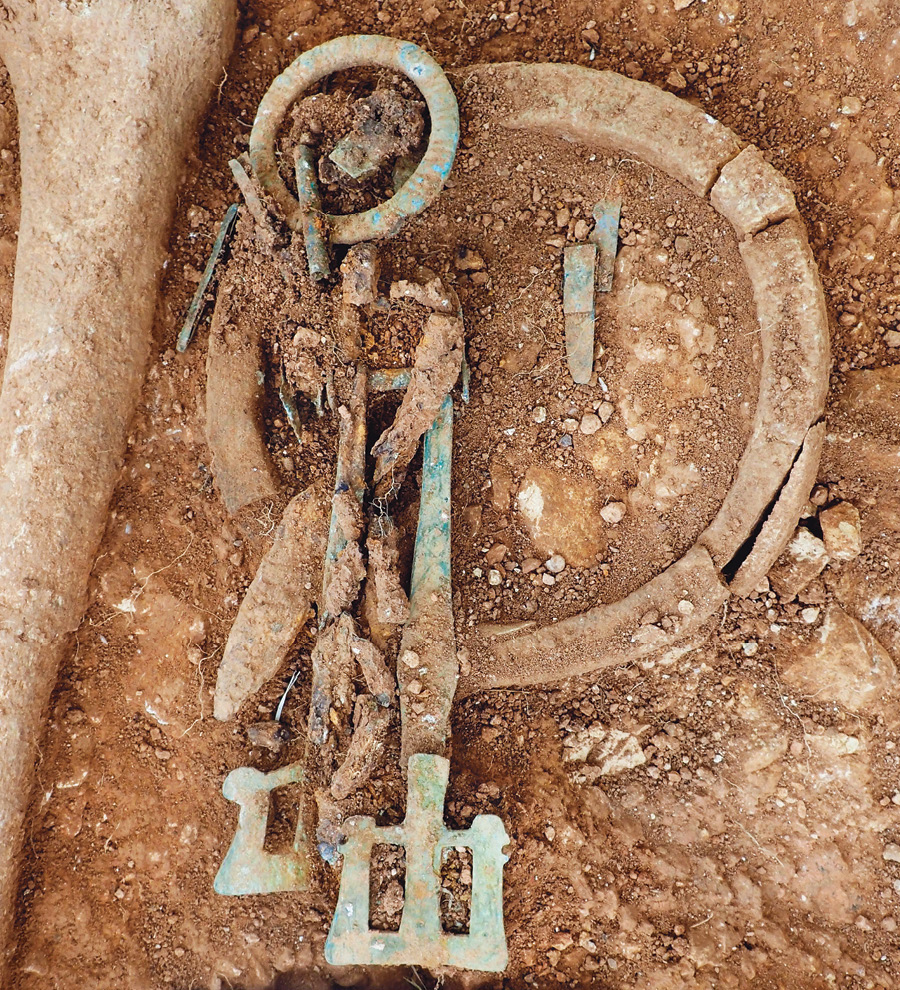 right Another ivory bag ring from Scremby, together with girdle hangers, which were found with skeleton SK12.