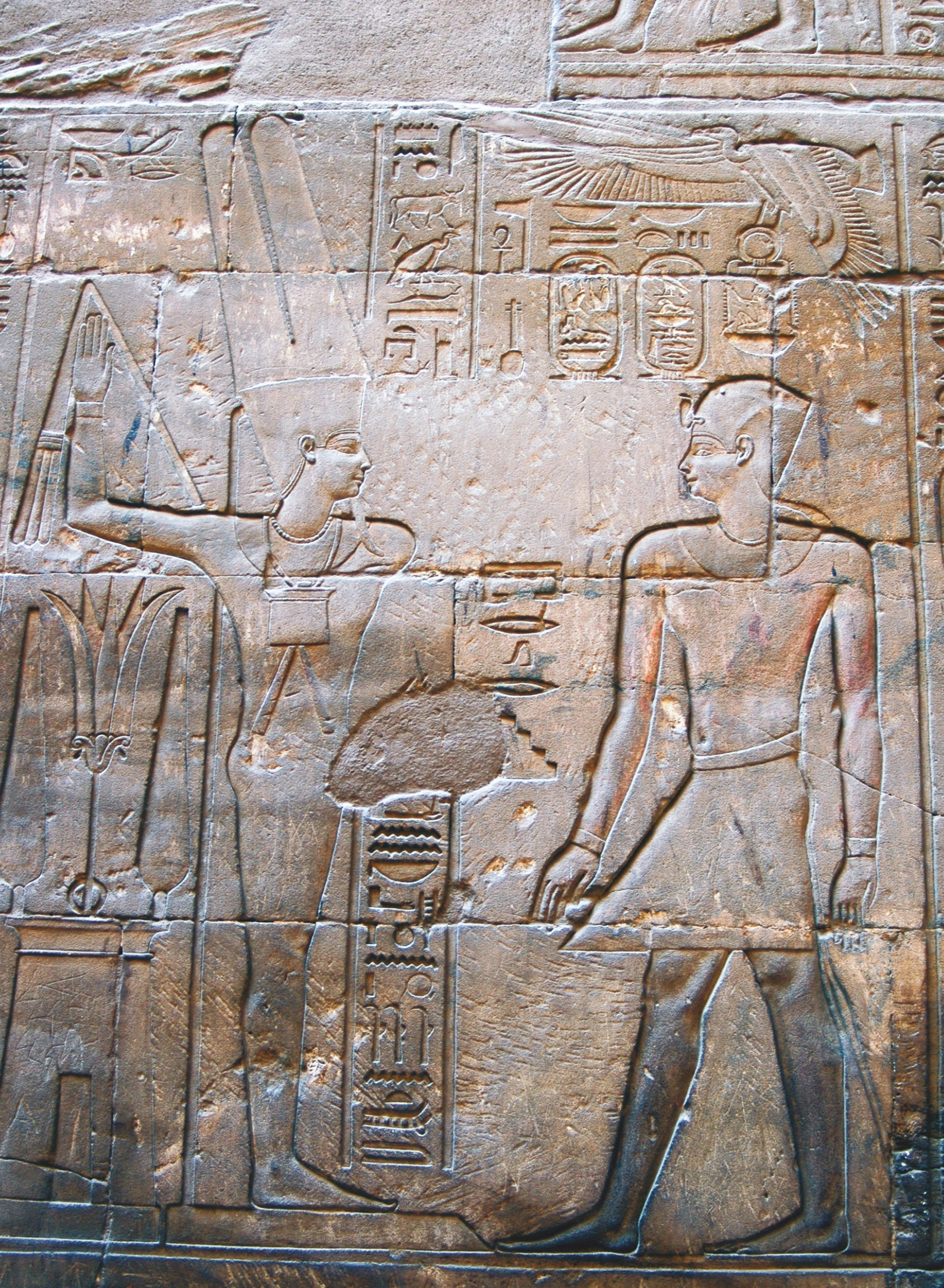 right Alexander the Great stands before the god Amun-Min in a scene from Luxor Temple. The tall pointed offerings behind the god represent an Egyptian type of lettuce often associated with Min, as its white sap was reminiscent of semen.