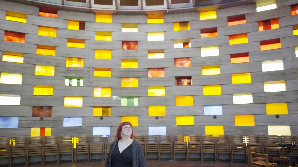Comedian Angela Barnes visits Meeting House at the University of Sussex, where she studied, voted for the first time, and got married. Image: Historic England.