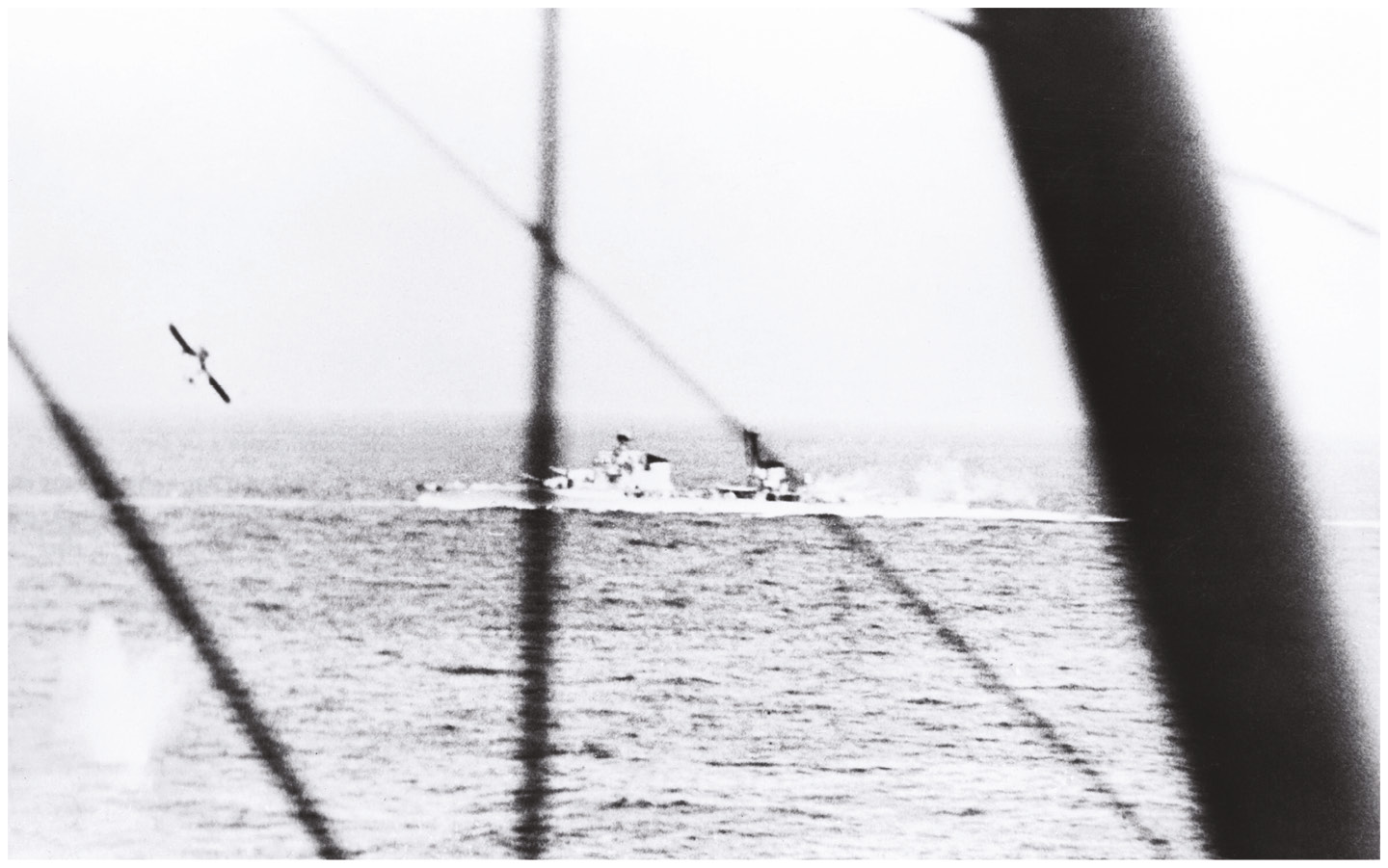 right The Italian heavy cruiser Bolzano under attack by Fairey Swordfish of the Fleet Air Arm on 28 March 1941. This photograph, taken from a second aircraft, shows the splash of a torpedo entering the water.