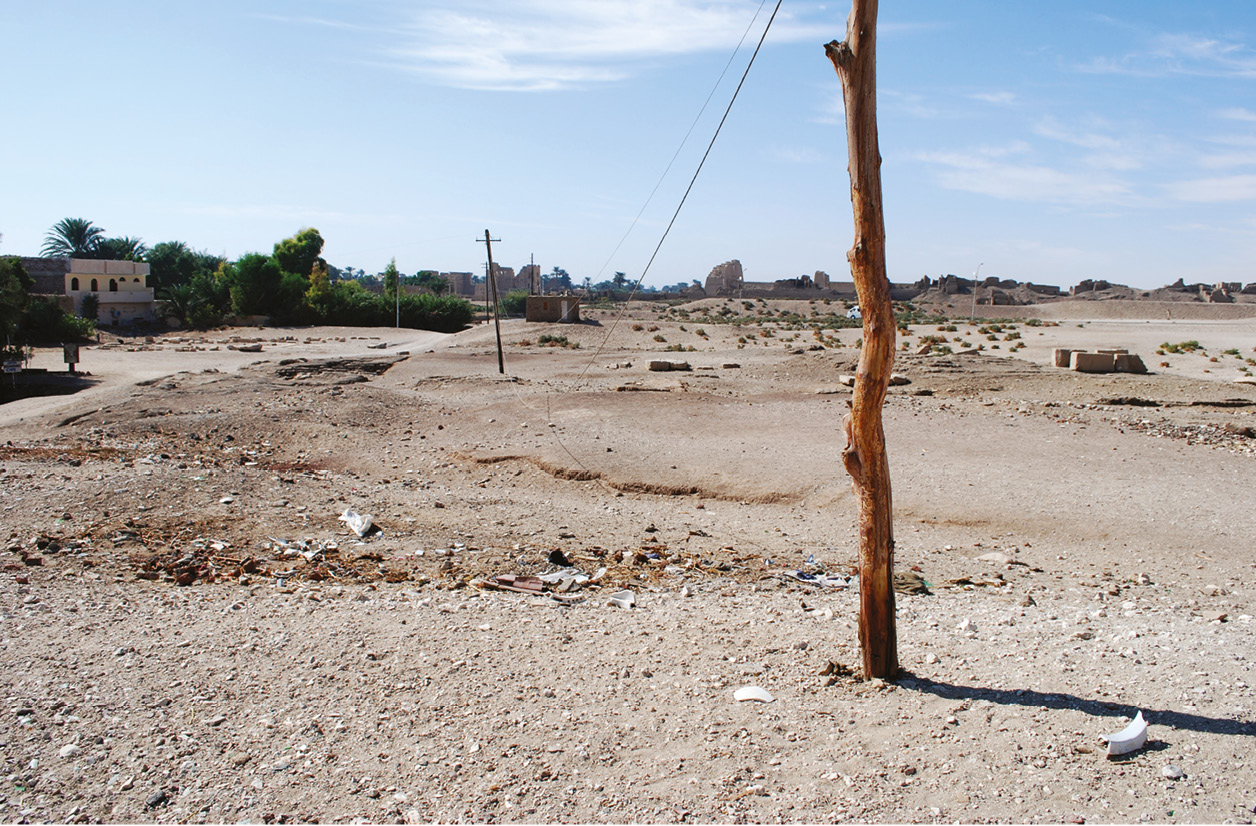 below View towards the remains of the Mortuary Temple of Amenhotep son of Hapu (the door jambs can be seen in the right distance). bottom The surviving pair of rear door jambs from the temple.
